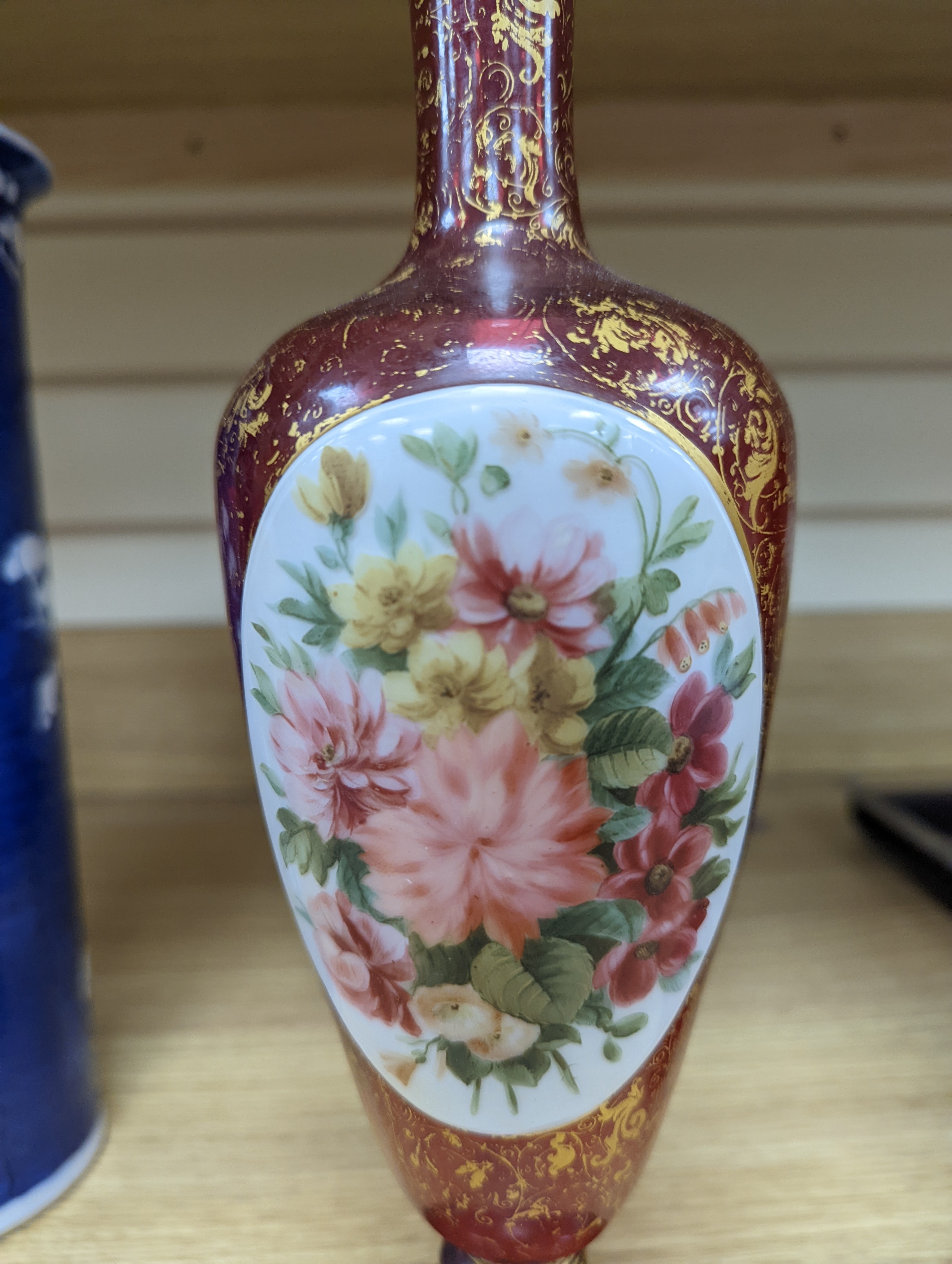 A pair of 19th century Bohemian enamelled and overlaid ruby glass vases 36cm
